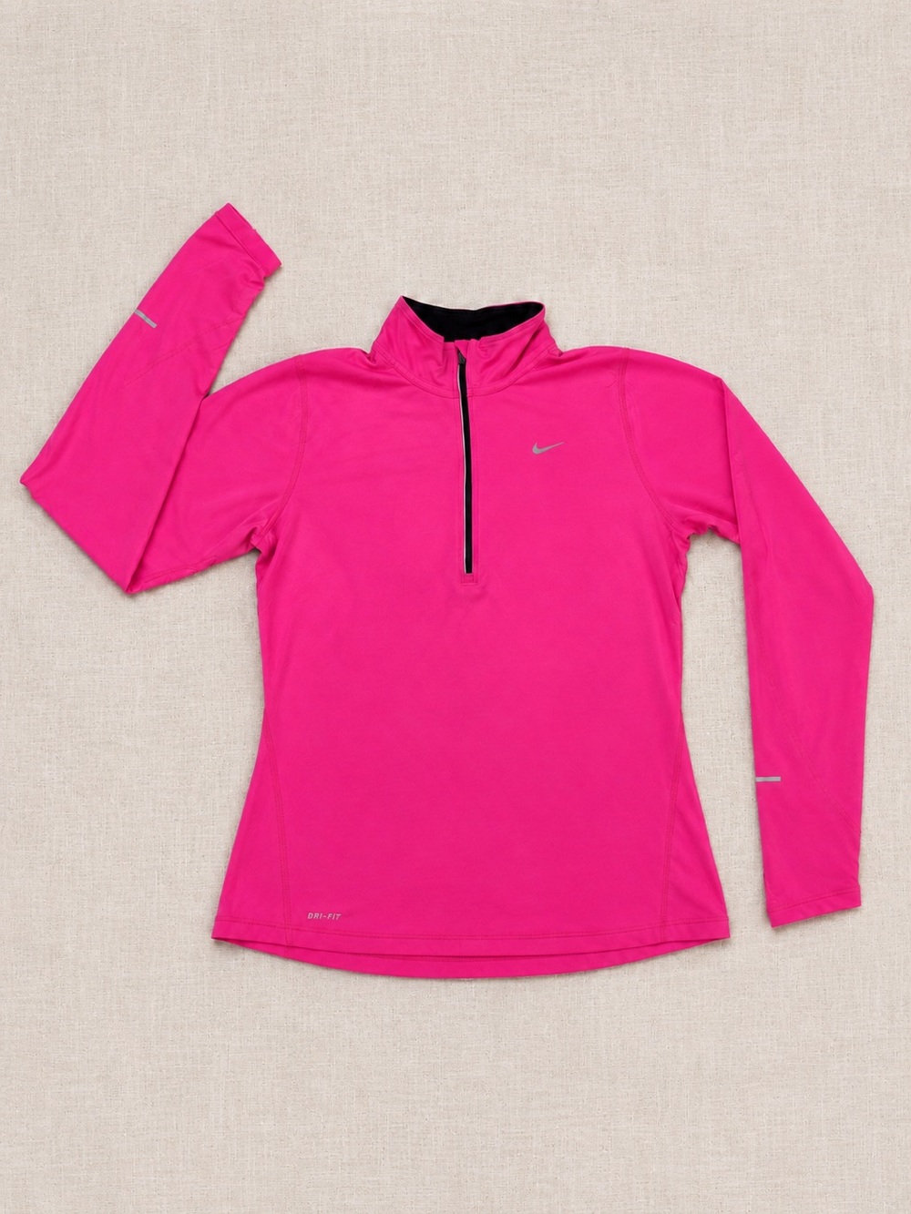 Nike Dri-FIT women’s 1/4 zip running top in bright pink, size Medium.